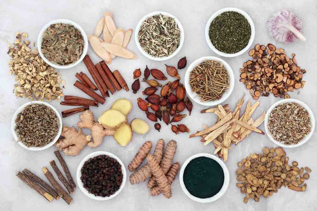 Flat lay of different herbs and spices used to relieve asthma symptoms