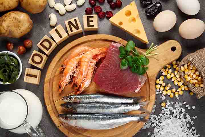 A variety of foods displayed with wooden blocks that spell the word ‘IODINE’