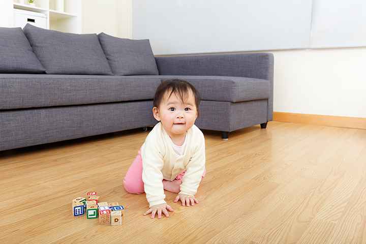 Asian baby girl play wooden toy block
