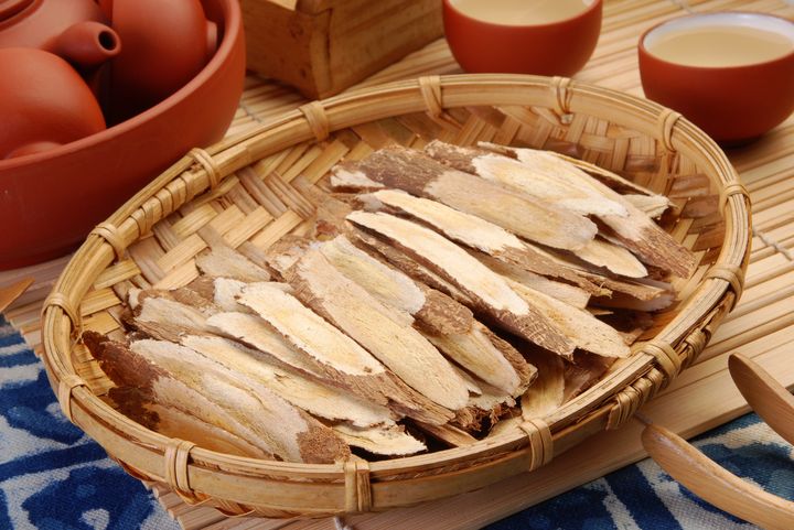 Dried and sliced astragalus roots in a woven basket