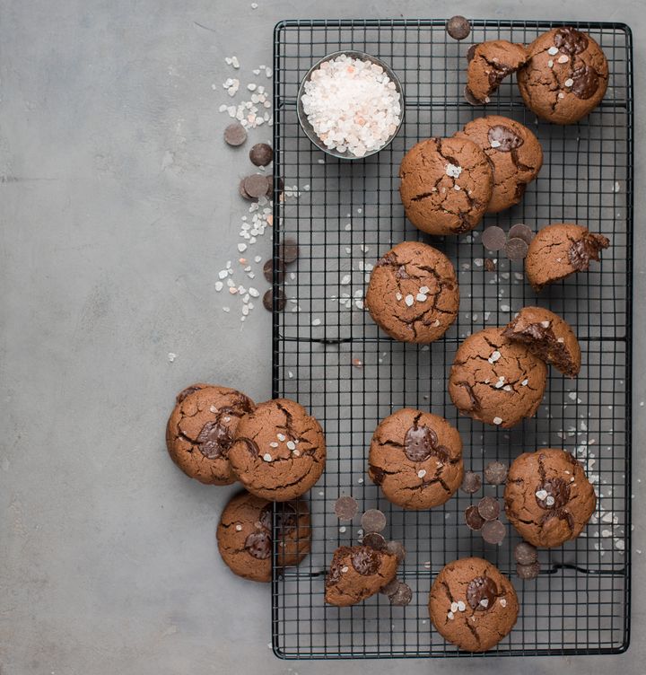 Chocolate chip cookies with dark chocolate and sea pink Himalayan salt on a gray concrete background.