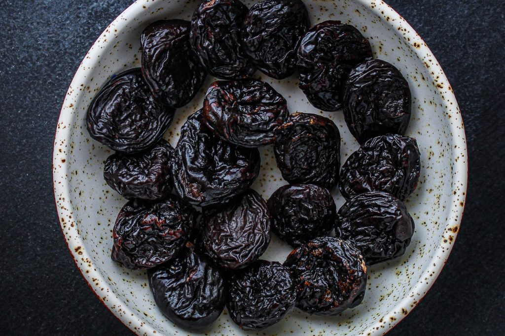 Smoked Plum (Wu Mei) in a white bowl